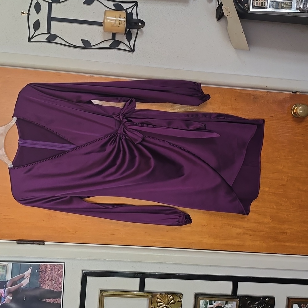 Satin sil mini dress. 95% polyester and 5% spandex.